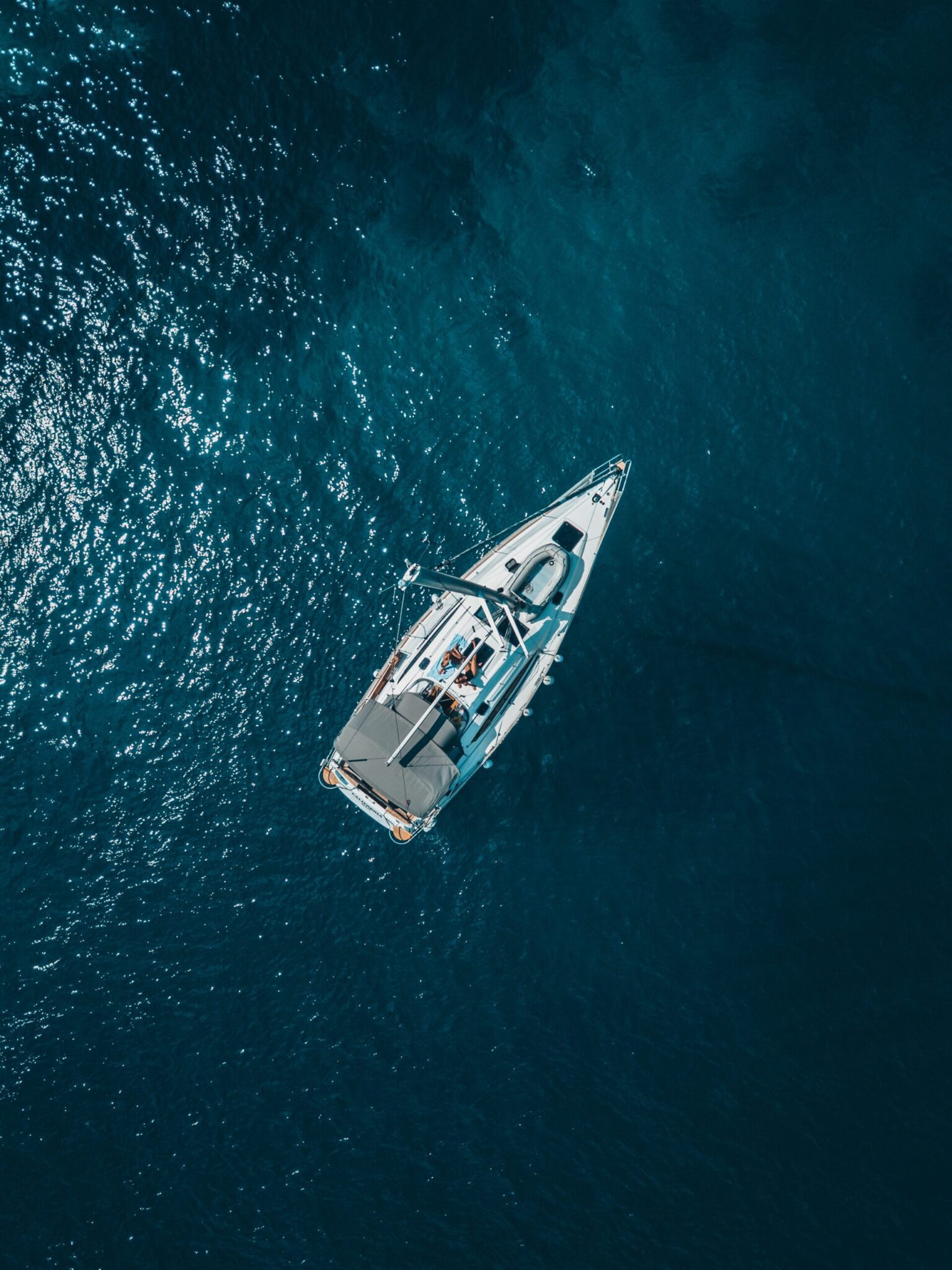 Monohull sailboat in blue ocean